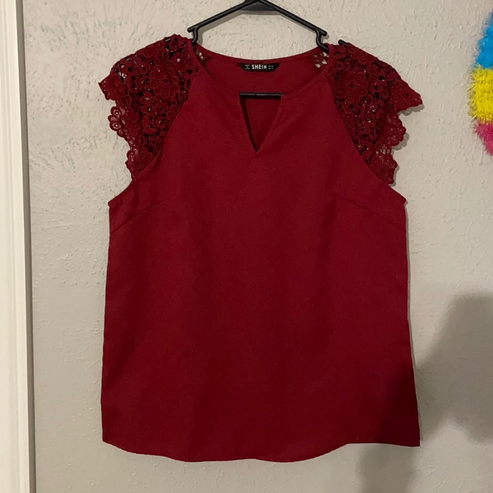 Red sleeveless blouse